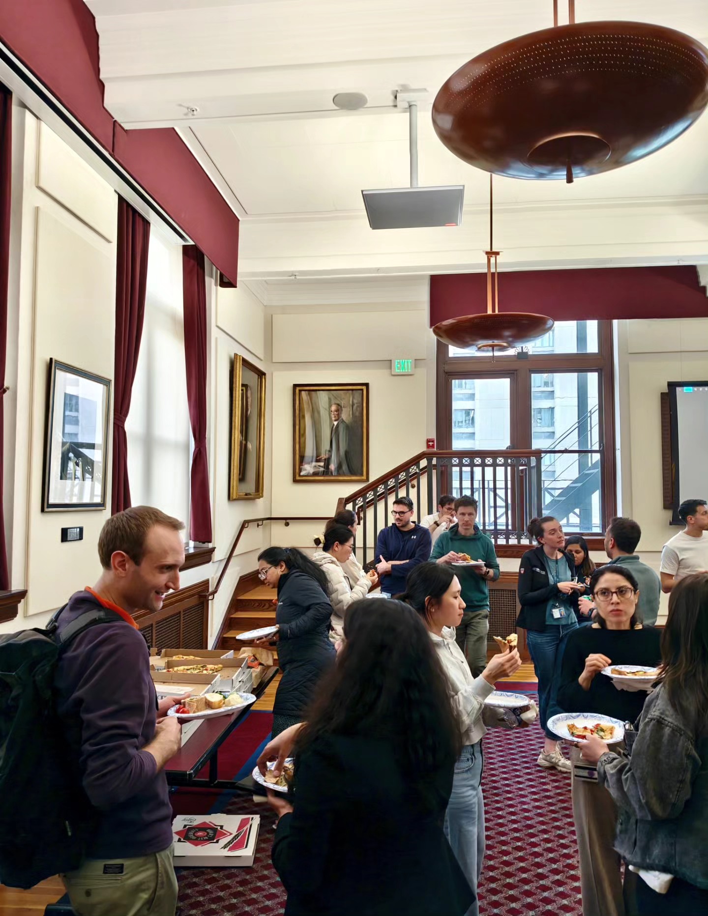 Audience gathered having snacks after the event